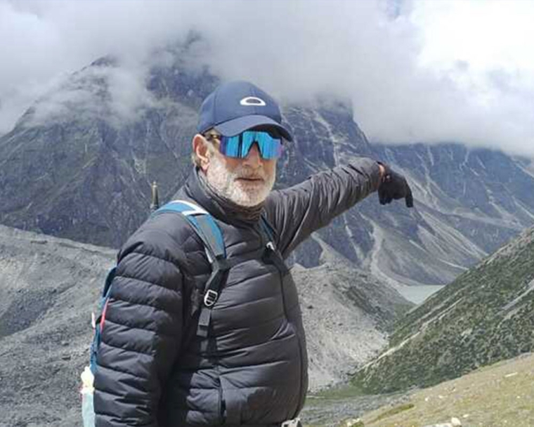 Sunil standing on a mountaintop