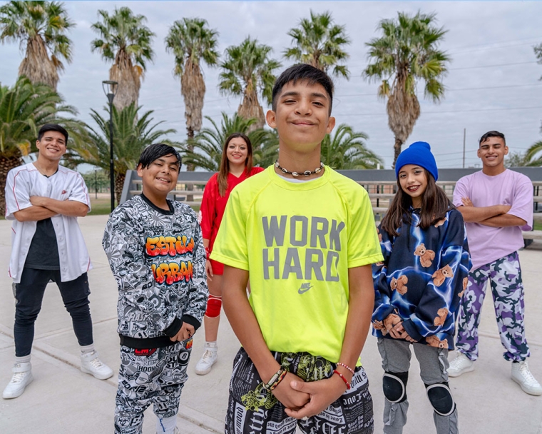 Bautista smiling with his dance crew