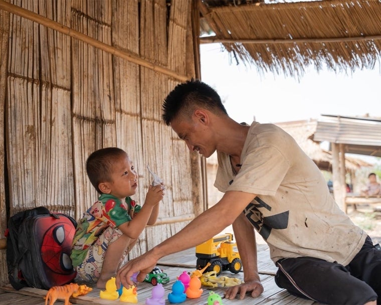 La Vang playing with Jingtee after his cleft surgery