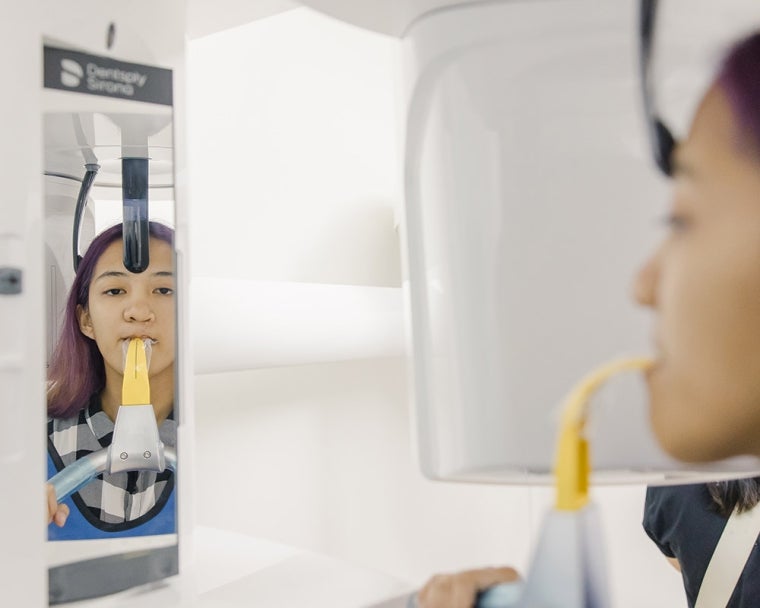 Cleft-affected patient receiving a Dentsply Sirona-supported oral x-ray